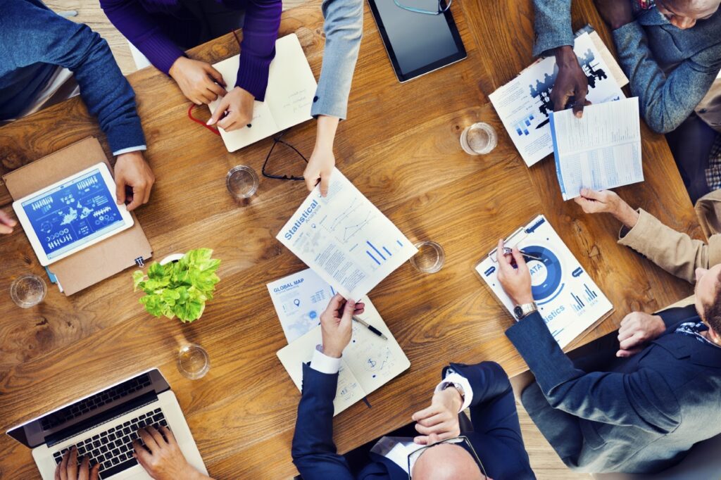 A group of people sitting around a table.